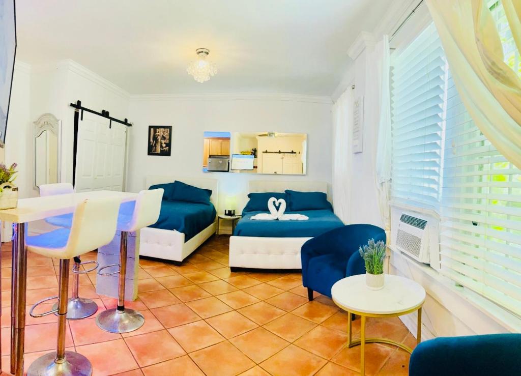 a living room with a couch and a table at south beach apartment 5 min walk to the ocean in Miami Beach
