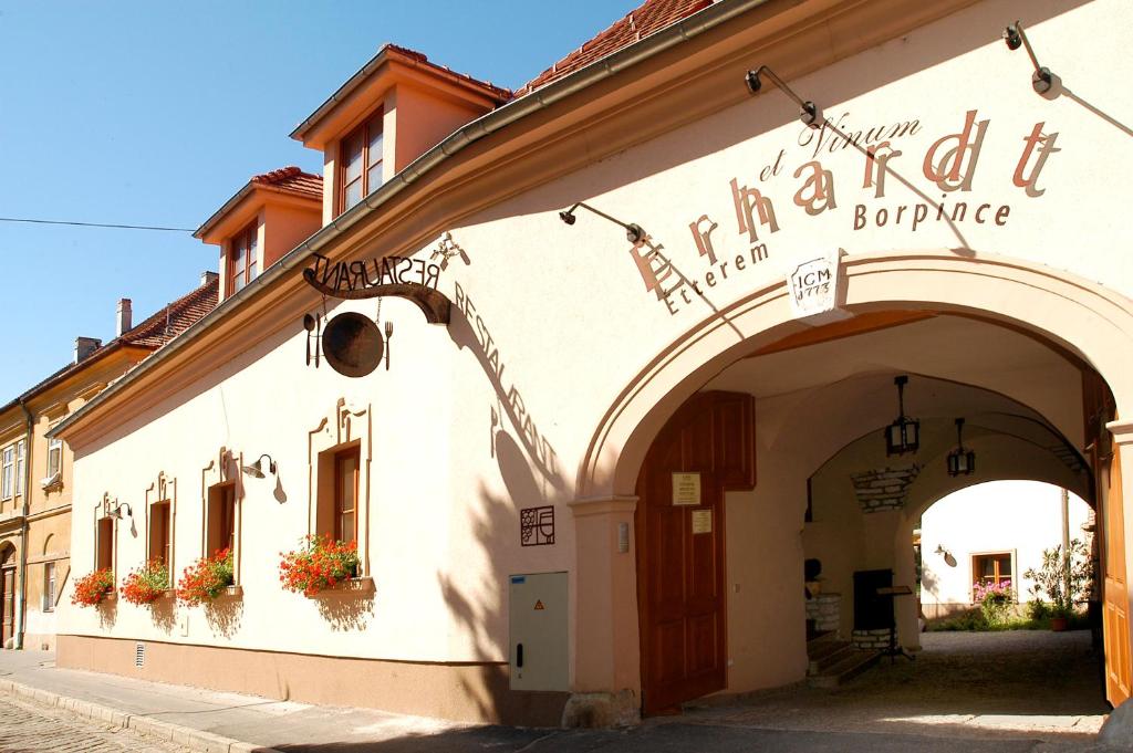 a building with an archway in a street at Erhardt Panzió in Sopron