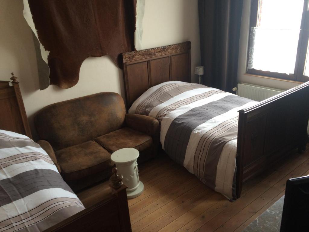Een bed of bedden in een kamer bij B&B Chez Mémère