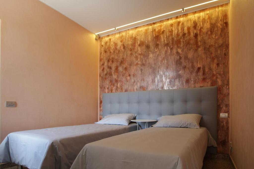 Postel nebo postele na pokoji v ubytování Villa Oldrado
