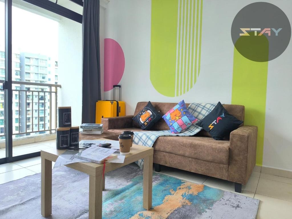 a living room with a couch and a table at The Garden 1Bed Comfort Joyful Netflix BySTAY in Skudai