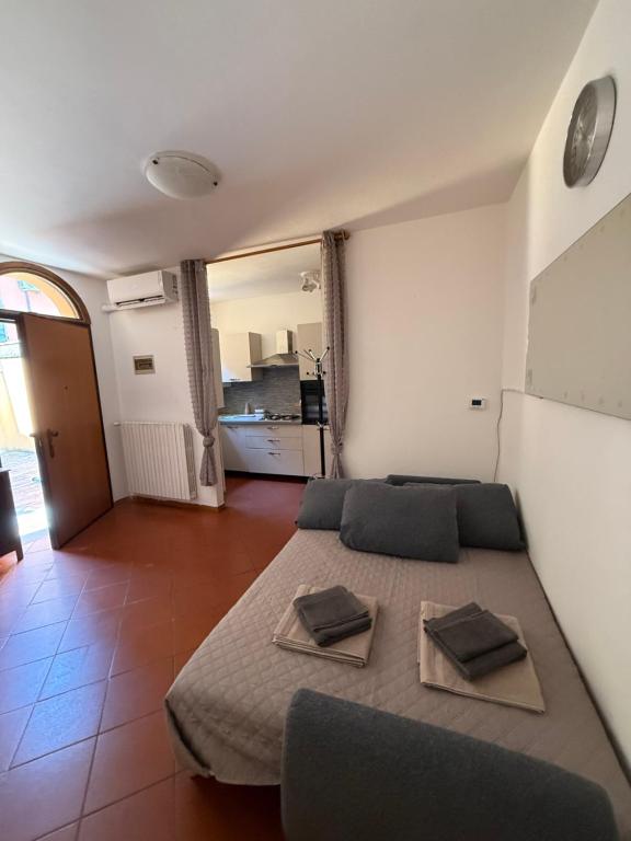 a bedroom with a bed with two pillows on it at B&B Emilia 330 Imola Centro Apartment in Imola