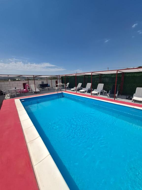 a swimming pool on the roof of a building at Neiras Apartments Blagaj in Blagaj