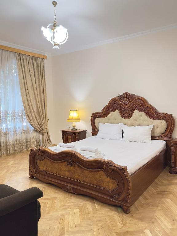 a bedroom with a large bed in a room at Davit's Apartments 21 in Tbilisi City