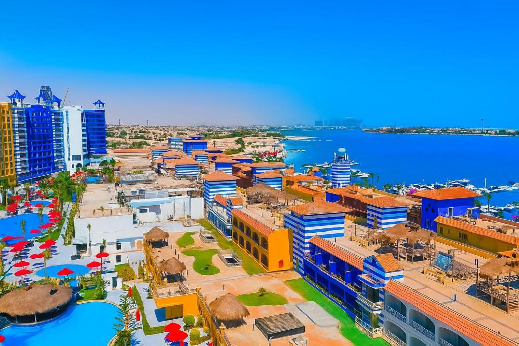 an aerial view of a city with the ocean at Private Hotel Rooms at Porto Marina - By Travel Agent Elias Tours in El Alamein
