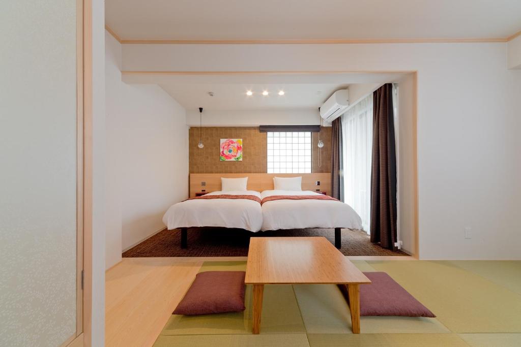 Tempat tidur dalam kamar di M's Inn Higashiyama