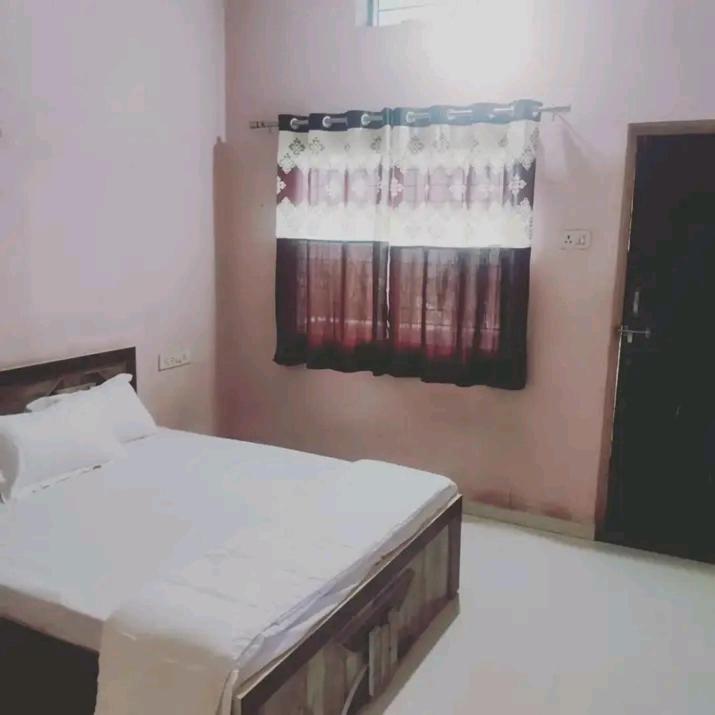 Ένα ή περισσότερα κρεβάτια σε δωμάτιο στο Stay House