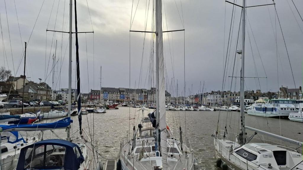 a bunch of boats are docked in a harbor at Heart of Tréguier Ideal for 2 people in Tréguier