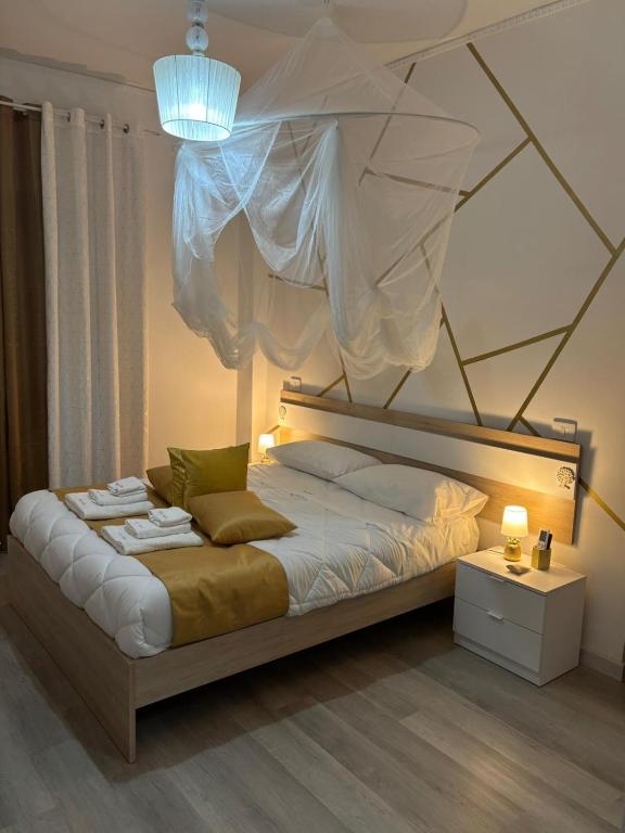 a bedroom with a large bed with a canopy at FaZi Home in Cosenza
