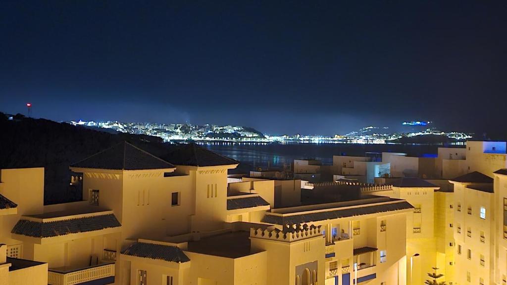 a view of a city at night at Résidence BAB Sebta apartment Ghali in Fnidek