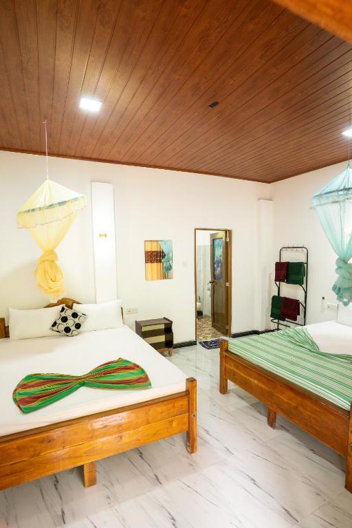 Postel nebo postele na pokoji v ubytování Horizon Resort & Hostel Sigiriya