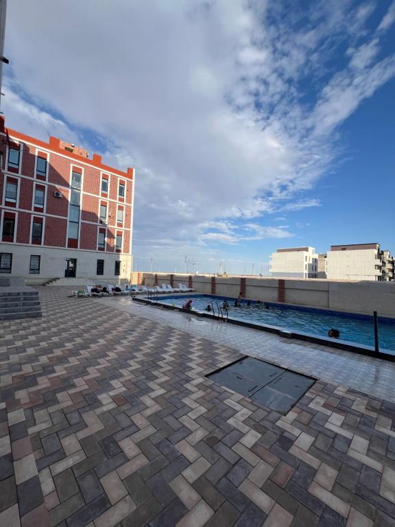 a view of a building and a body of water at Royal resort in Aktau