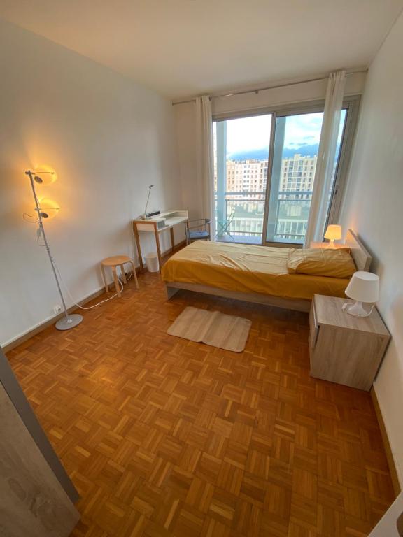 Ένα ή περισσότερα κρεβάτια σε δωμάτιο στο FLCbm-Pharo-Catalans-Vue Mer