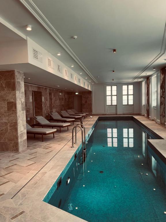 a pool in a hotel room with a swimming pool at SeeBlick Apt 7 Bałtyk Luxury Residence in Międzyzdroje