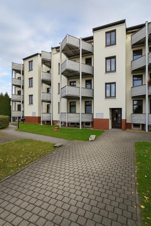 an empty parking lot in front of an apartment building at TOP ANGEBOT - große Wohnung - max 6 Personen - WiFi - Waschmaschine - Badewanne - 2 Parkplätze - zentrale Lage - große Küche TOP in Chemnitz