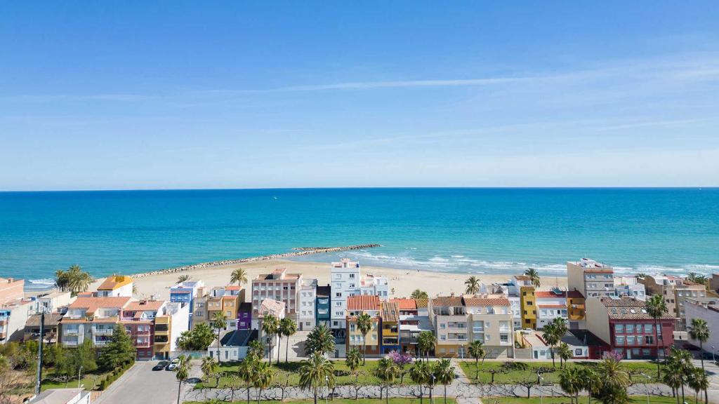 an aerial view of a city and the beach at Duplex Deluxe in Torreblanca