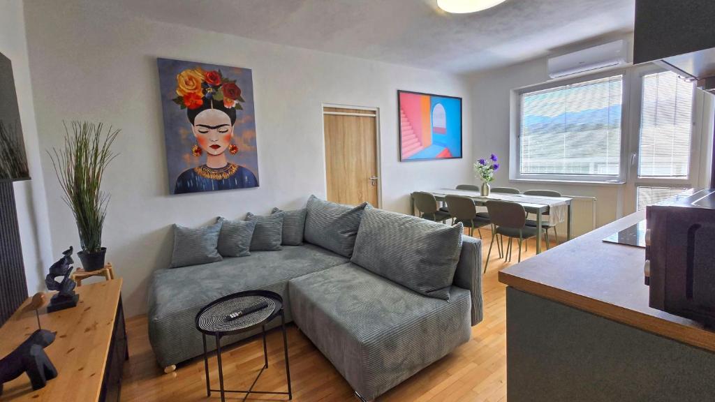 a living room with a couch and a table at Urban Zen Stay in Banská Bystrica