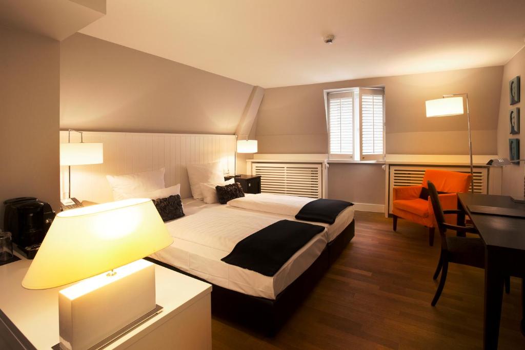 Cama ou camas em um quarto em Hotel Victoria