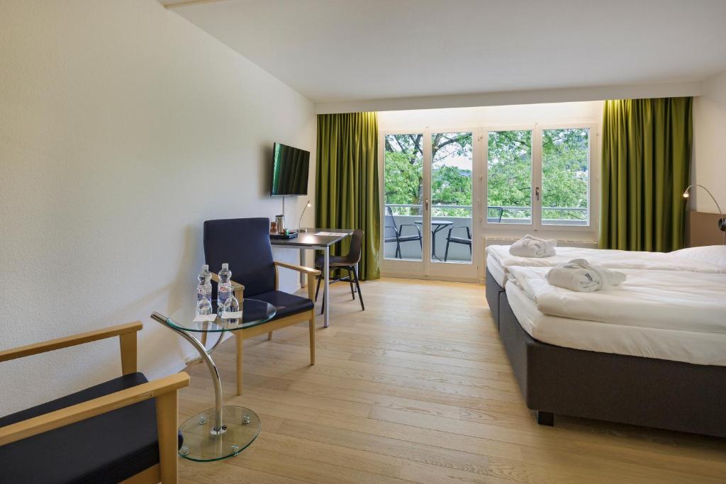 Postel nebo postele na pokoji v ubytování VitalBoutique Hotel Zurzacherhof