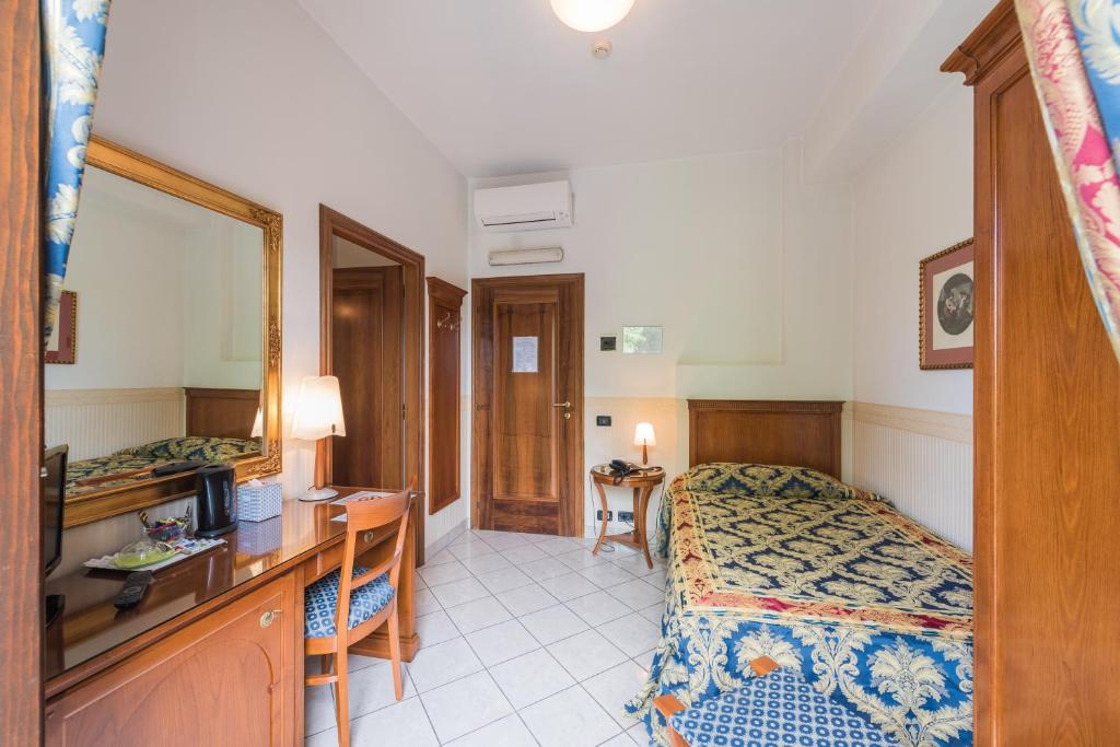 Postel nebo postele na pokoji v ubytování Hotel Belvedere