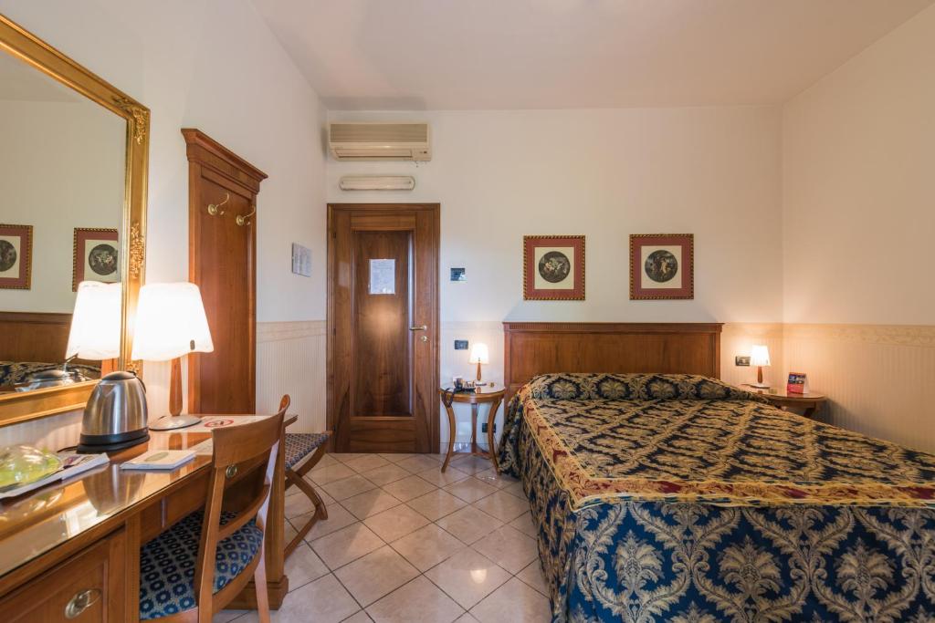 Postel nebo postele na pokoji v ubytování Hotel Belvedere