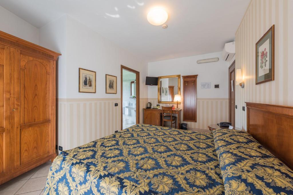 Postel nebo postele na pokoji v ubytování Hotel Belvedere