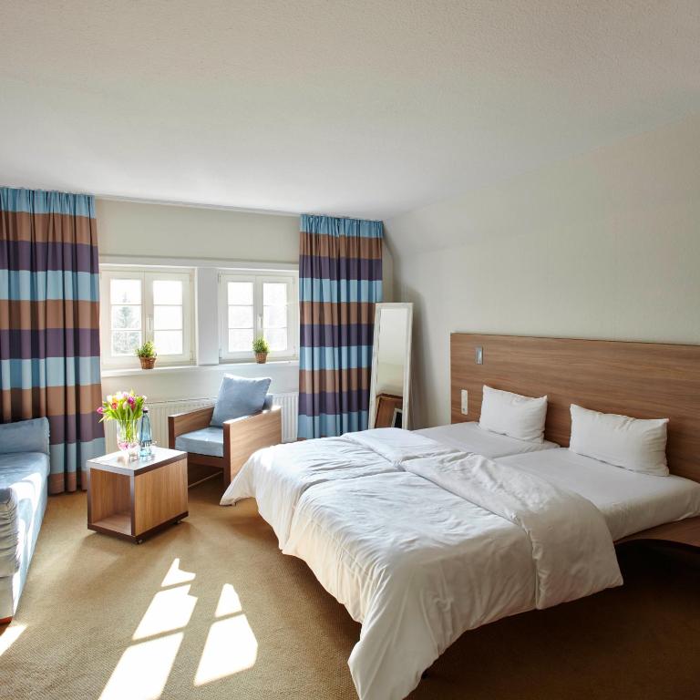 Postel nebo postele na pokoji v ubytování Hotel Hof Tütsberg
