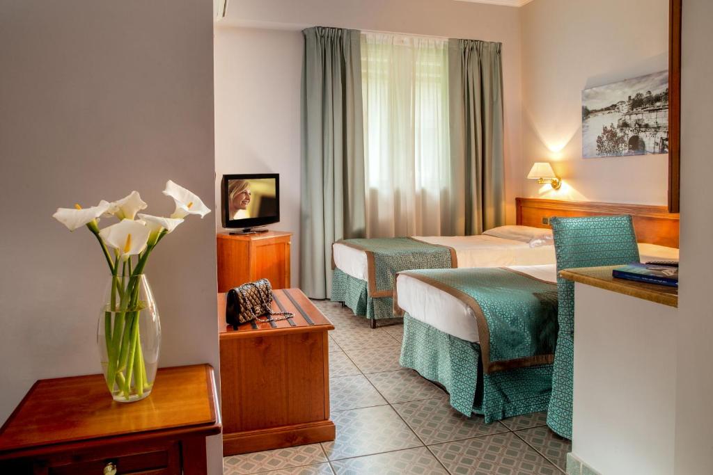 Postel nebo postele na pokoji v ubytování Marini Park Hotel