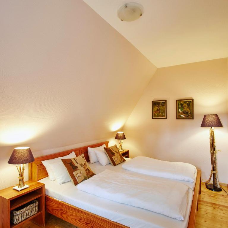 Postel nebo postele na pokoji v ubytování Hotel Hof Tütsberg