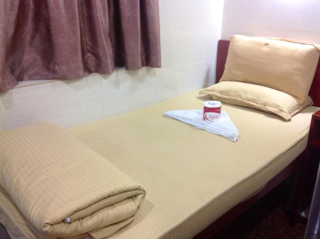 Postel nebo postele na pokoji v ubytování New Yan Yan Guest House reception 9th floor Flat E4 E6