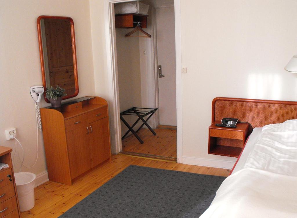 Postel nebo postele na pokoji v ubytování Hotel Emma