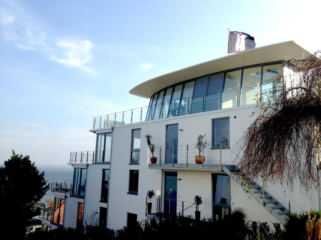 a white building with a dome on top of it at Triton Suite in Eckernförde