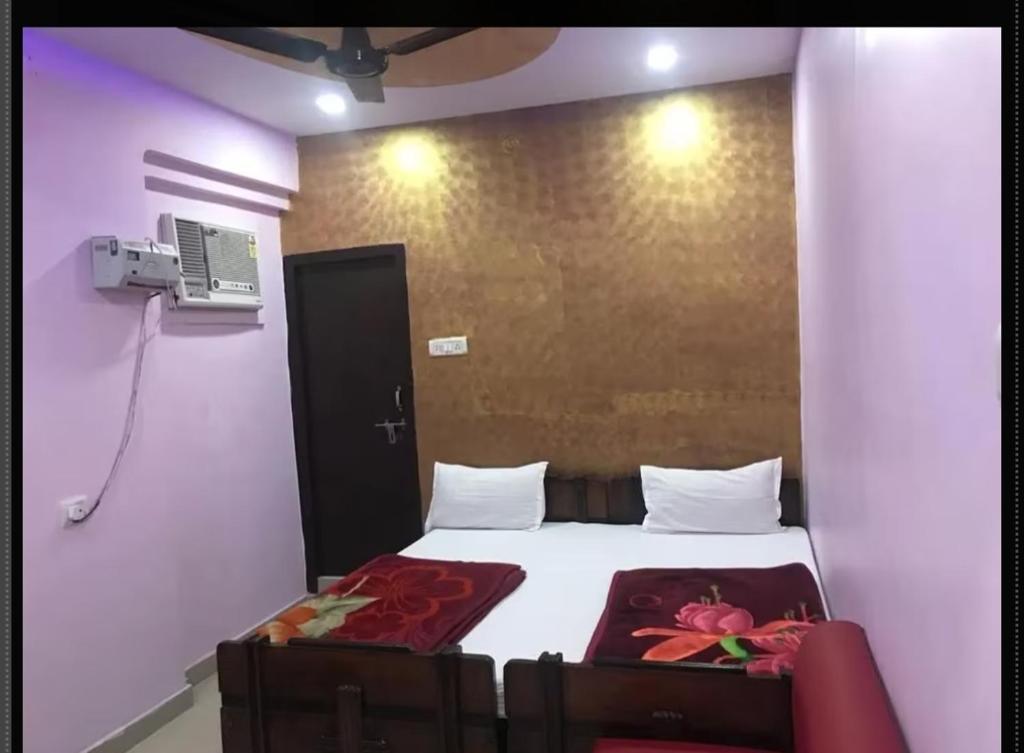 Katil atau katil-katil dalam bilik di Hotel Galaxy
