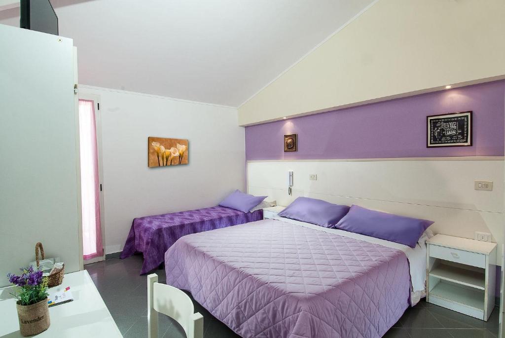 Postel nebo postele na pokoji v ubytování Hotel Cheri
