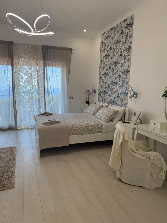 a bedroom with a large bed and a ceiling at Villa Asia Relais in Massa Lubrense