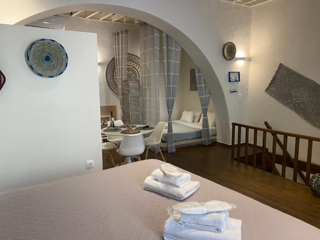 a room with a table with towels on top of it at Rhodes Old Town Harmony Suite in Rhodes Town
