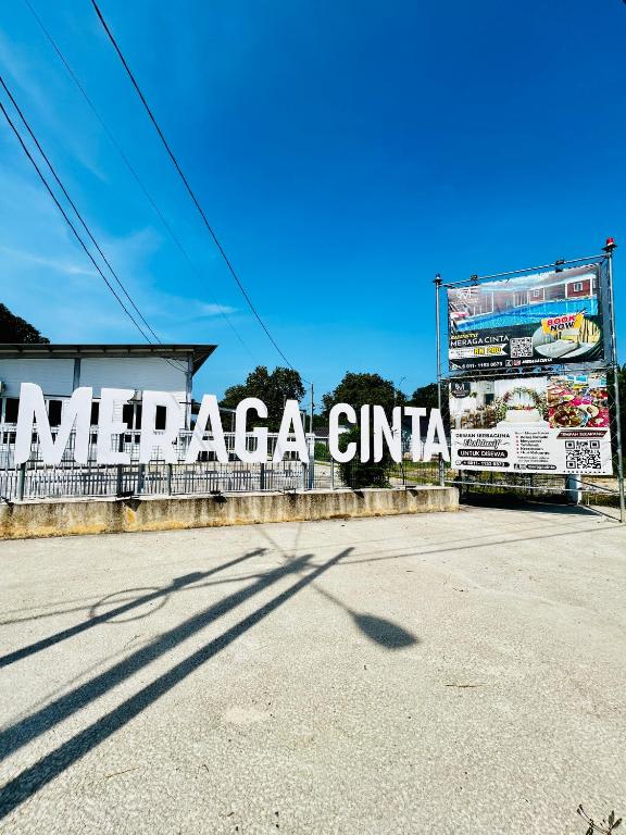 a sign that says akagi cinema on a building at Meraga Cinta Kijal in Kijal