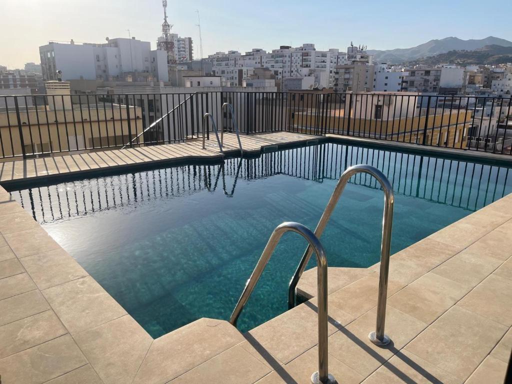a swimming pool on the roof of a building at iloftmalaga Martínez Maldonado in Málaga