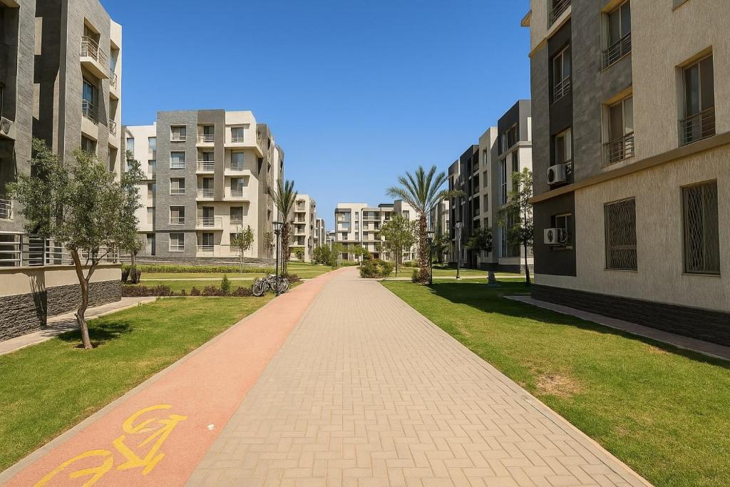 a walkway between two buildings in a city at 407. Spacious 3BR Apt. 2 Baths Gated Community in Sheikh Zayed