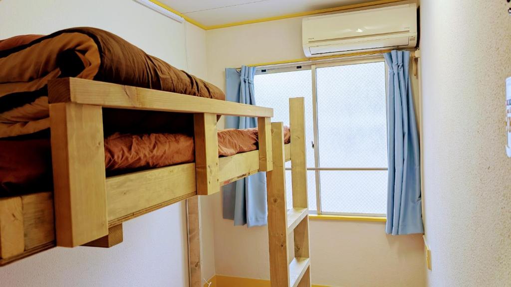 Postel nebo postele na pokoji v ubytování Joe Backpackers