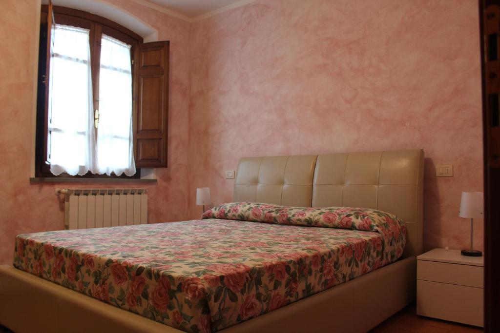 Postel nebo postele na pokoji v ubytování Lady Frantoio Toscano