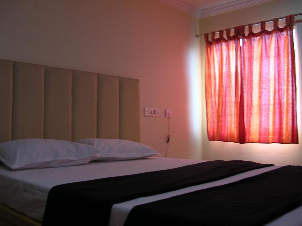 Postel nebo postele na pokoji v ubytování Hotel Woodside