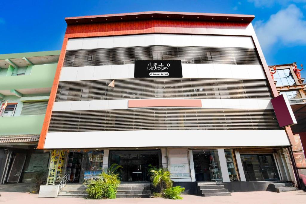 a building with a sign on the side of it at Collection O Railway Station formerly Hotel Okasu in Raipur