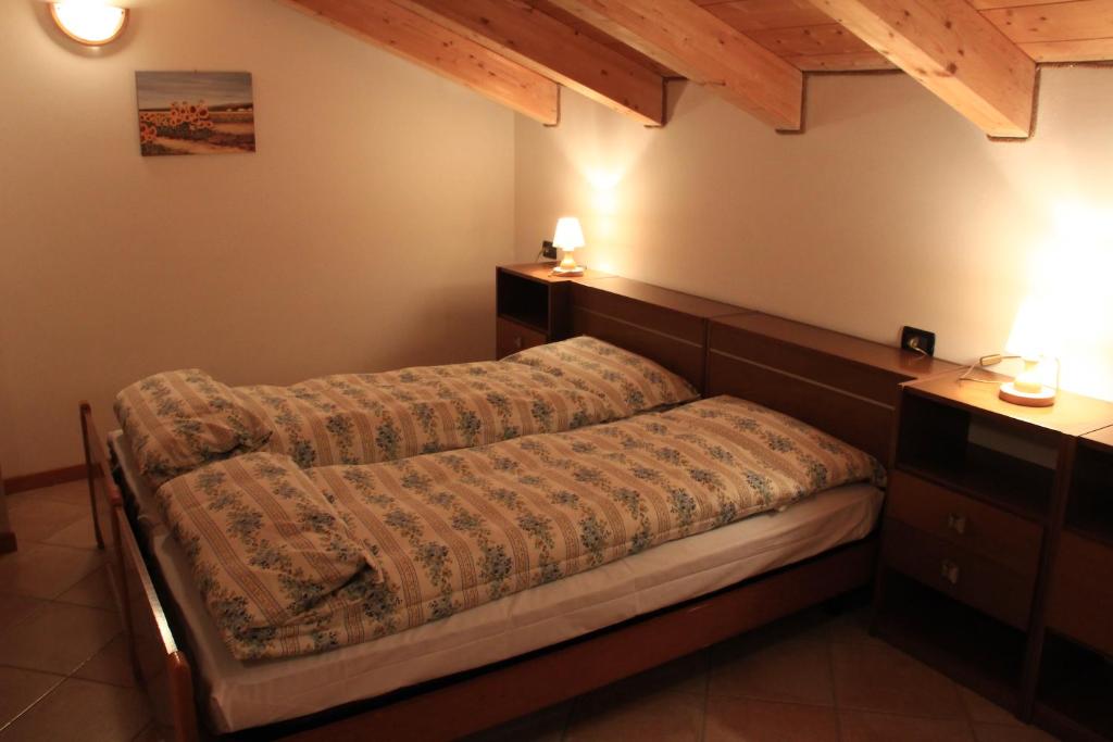 Postel nebo postele na pokoji v ubytování Appartamenti Rumo