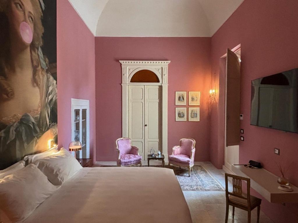 Postel nebo postele na pokoji v ubytování Appartamento Royale - Palazzo Villani Lubelli