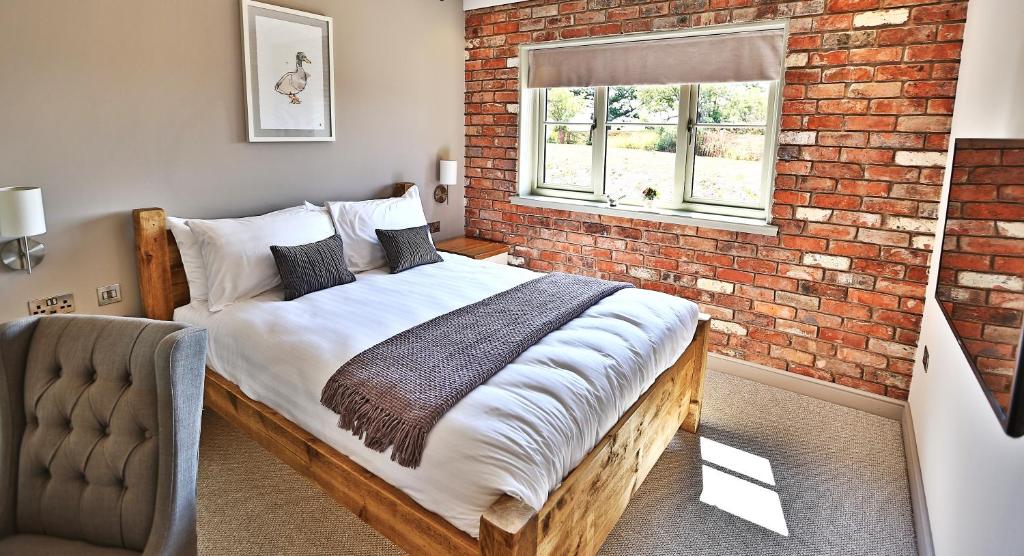 Ένα ή περισσότερα κρεβάτια σε δωμάτιο στο Cock O' Barton