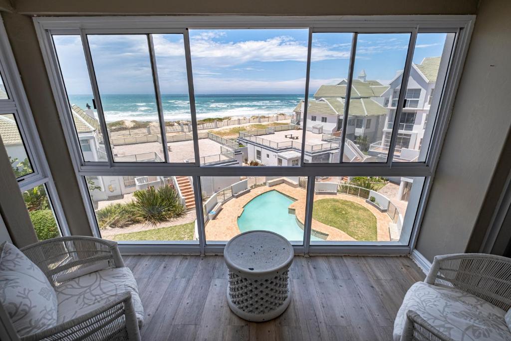 a living room with a view of the ocean at Beach life in Summerstrand