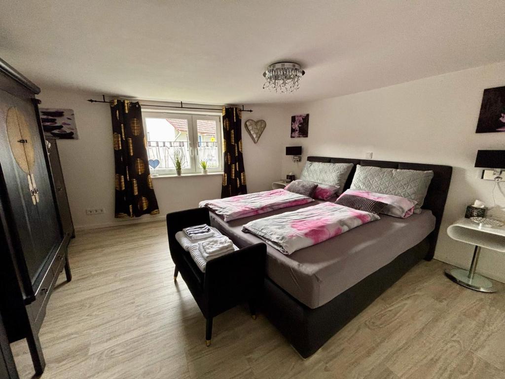 a bedroom with a bed and a sink in it at Kleiner Kalle in Melsungen