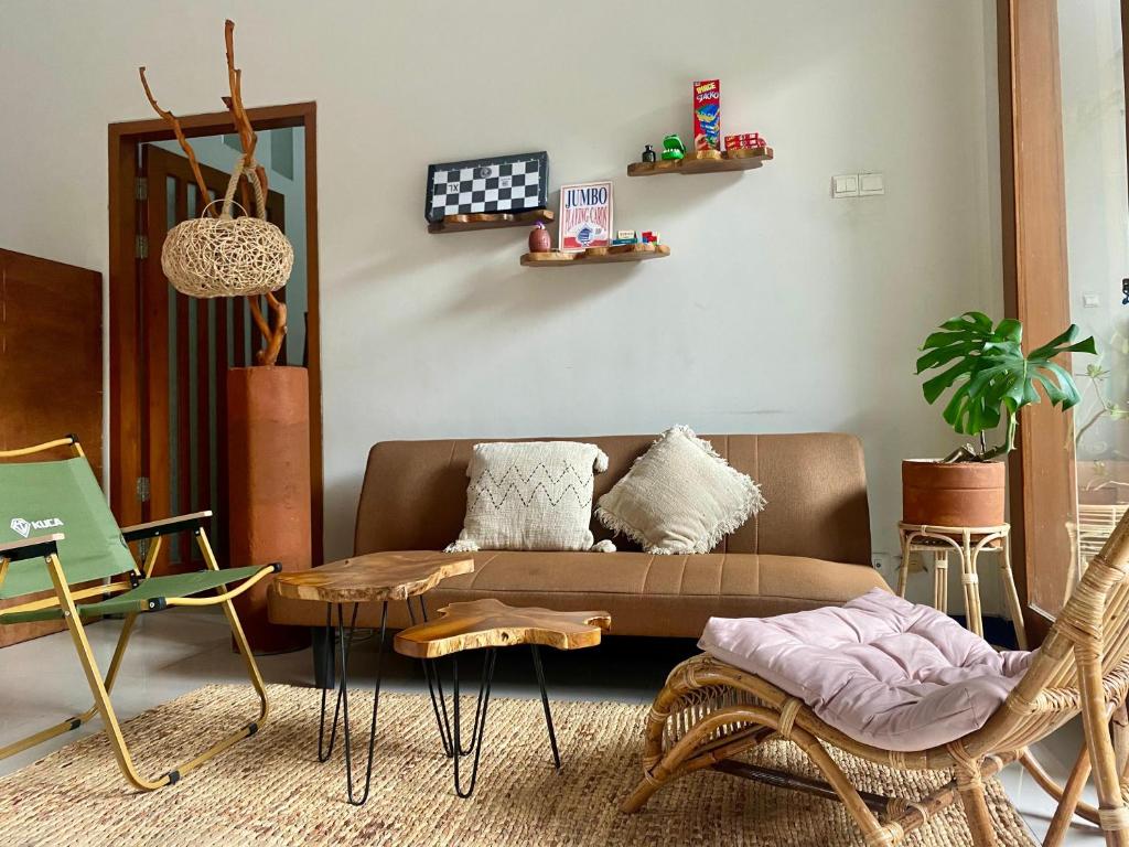 a living room with a couch and a coffee table at Z Malang Hostel in Malang