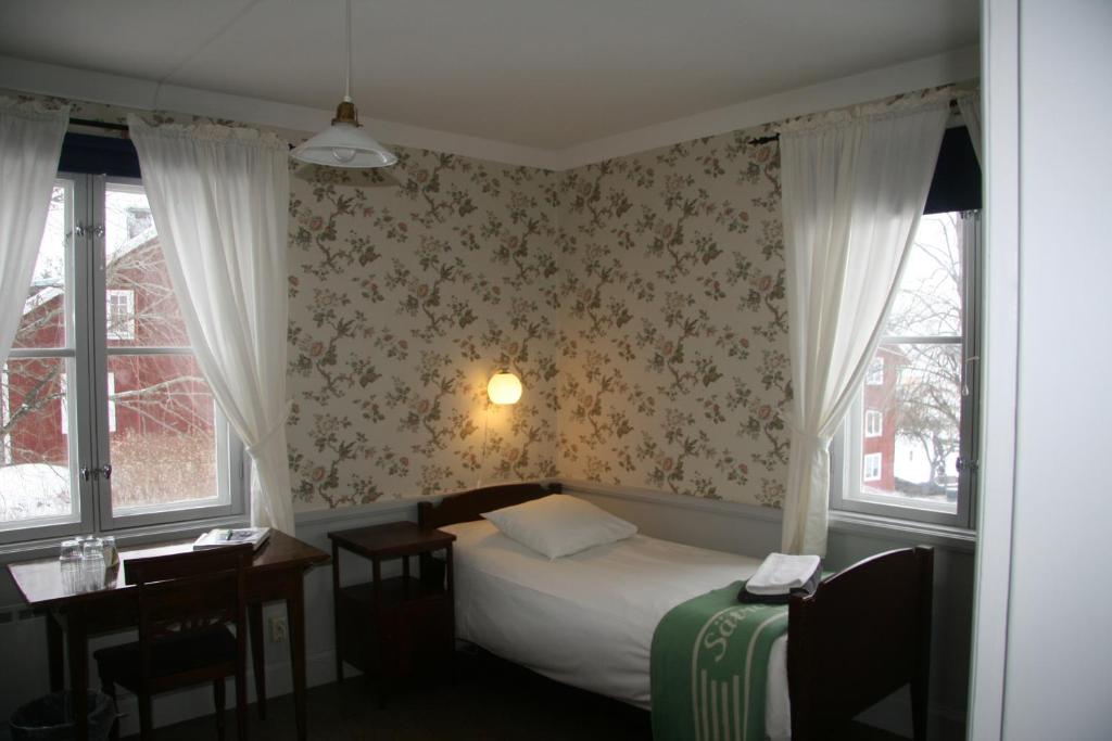Postel nebo postele na pokoji v ubytování Sätra Brunn Hälsobrunn